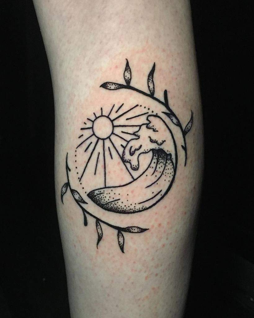 Minimalist tattoo featuring a stylized ocean wave, sun, and leafy branches forming a circular frame with fine line and dotwork details