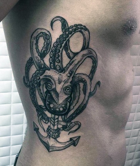 Tattoo of a hybrid octopus and wolf above an anchor on a side torso