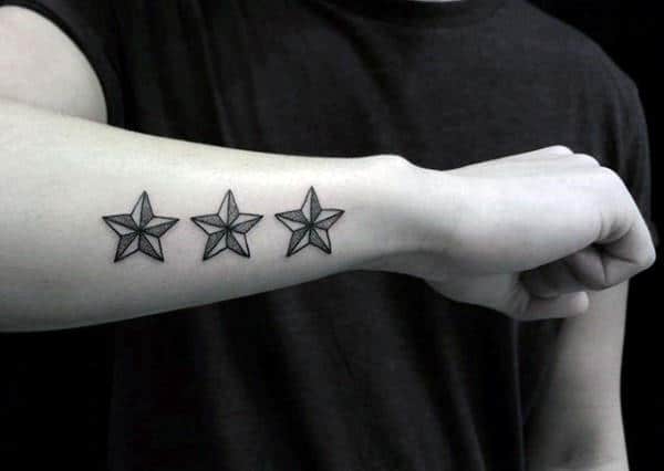 Nautical Stars Tattoo On Mans Outer Forearm