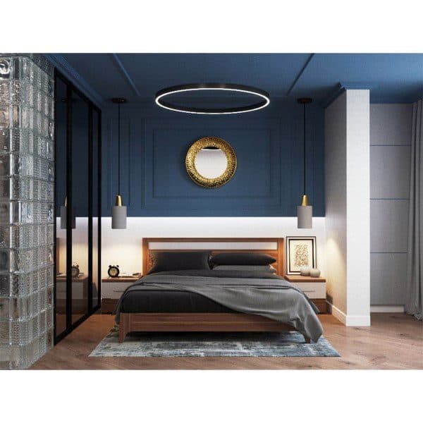 Modern navy and white bedroom with a circular ceiling light and minimalist decor.