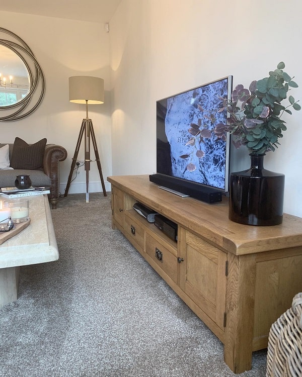 neutral wood entertainment unit black vase tv wall mirror