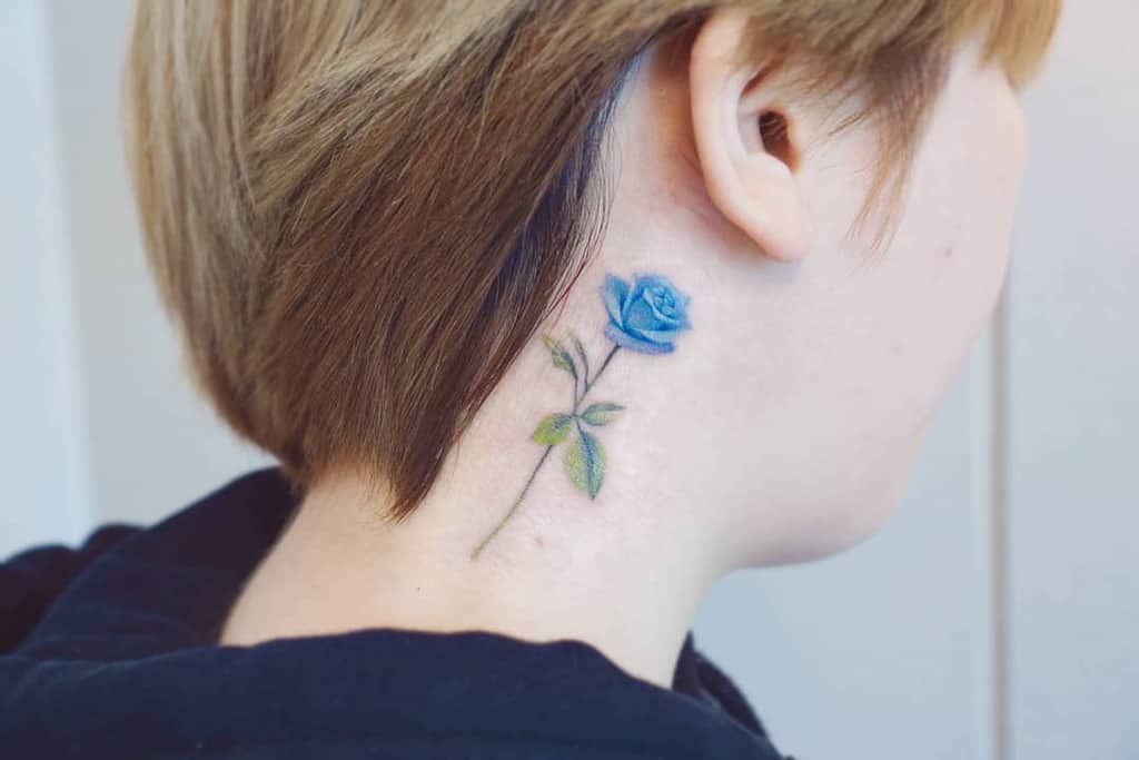 Blue rose tattoo on the neck