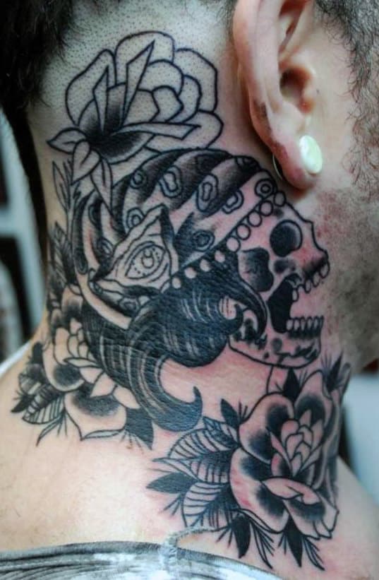 A person with a detailed skull and rose tattoo on their neck