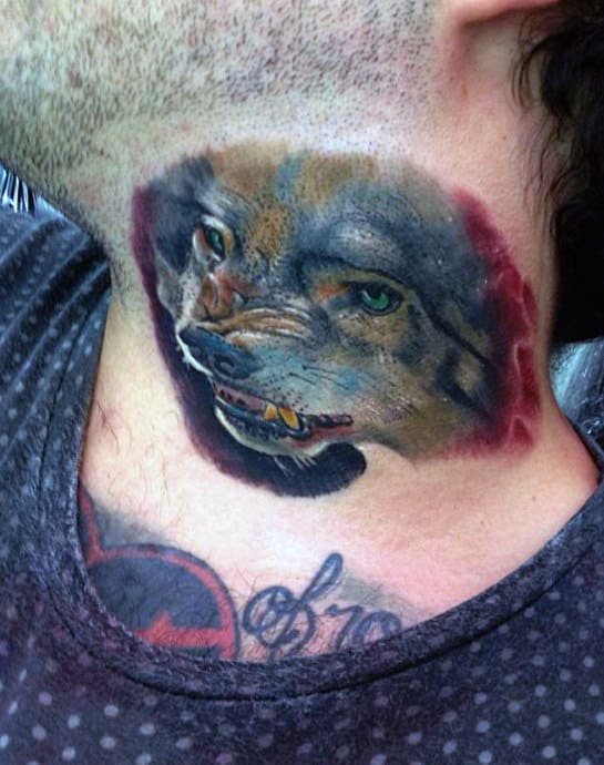 Tattoo of a snarling wolf's head on the side of a person's neck
