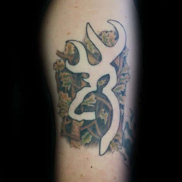 Negative Space Browning Camo Tattoo On Mans Arm