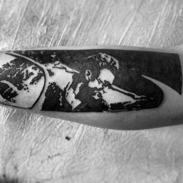 Minimalist blackwork tattoo of James Dean leaning on a car, created with bold negative space and silhouette-style shading.