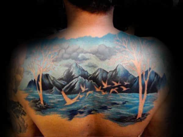 Negative Space Guys Blue Ink Landscape Back Tattoo