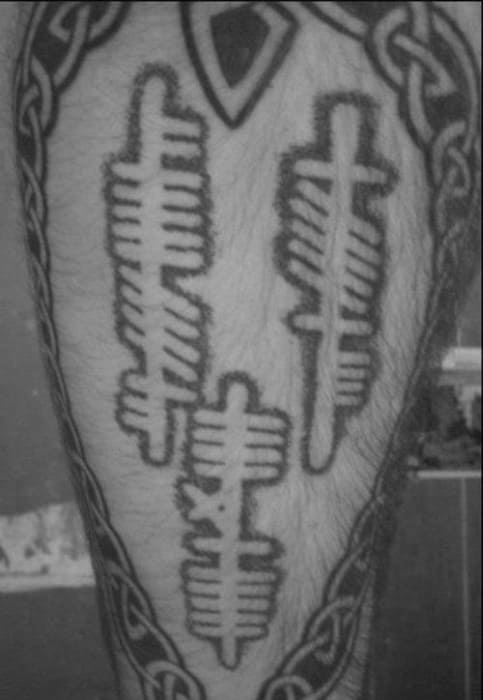 Negative Space Leg Ogham Tattoo Design Ideas For Males
