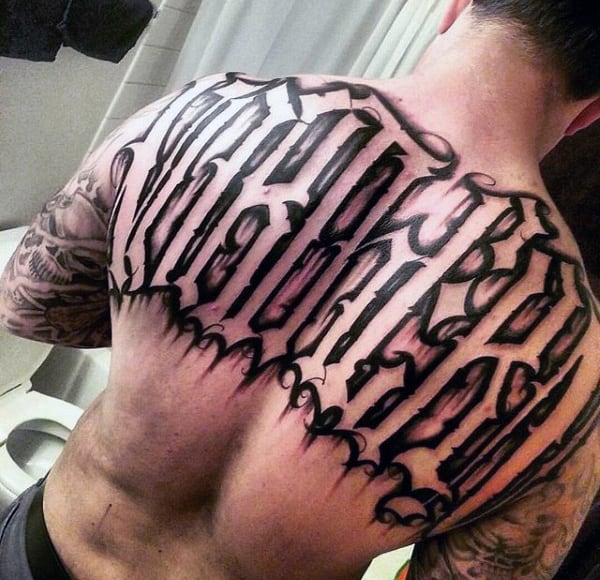 Negative Space Lettering Mens Old English Last Name Tattoo Design On Upper Back