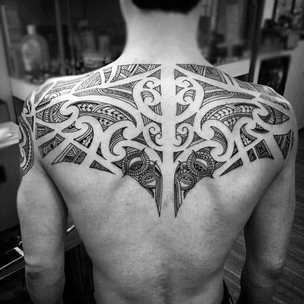 Negative Space Male Upper Back Tribal Tattoo Designs