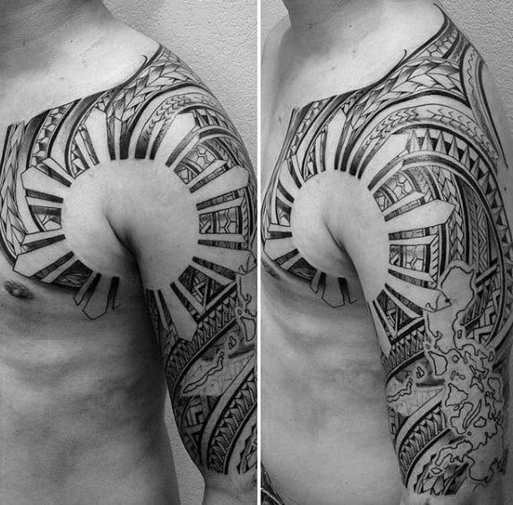 Filipino sun tattoo spanning the shoulder, chest, and upper arm with tribal rays, intricate geometric patterns, and a map of the Philippines.
