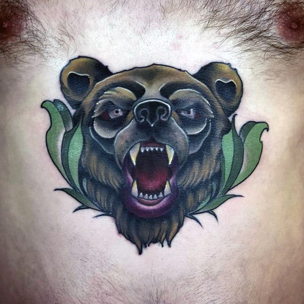 Neo-traditional bear tattoo on the chest featuring a snarling bear with dark shading, piercing eyes, and bold green leaf accents.