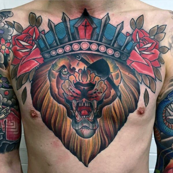 Neo-traditional chest tattoo of a roaring lion with a crown, red roses, and bold shading symbolizing power, courage, and royalty.