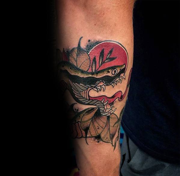 Neo-traditional tattoo of a black snake with fierce fangs, set against a bold red sun and leafy accents, creating a striking contrast and dynamic design.