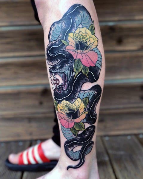 Neo-traditional tattoo of a black snake slithering around vibrant yellow and pink roses, with bold shading and intricate floral details.