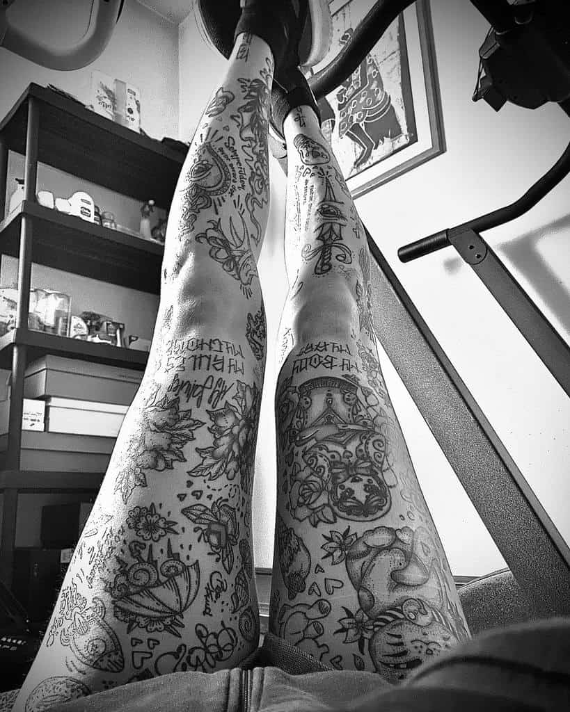 Intricate tattoo leg sleeve, featuring a variety of designs including flowers, geometric shapes, and detailed illustration