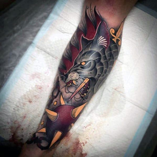 Neo-traditional tattoo of a snarling wolf with dark scales, a spiked mace, bold shading, and gold accents for a fierce, medieval-inspired design.