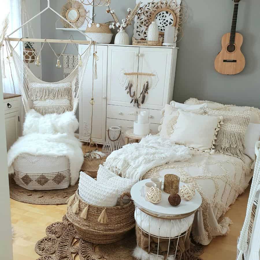 Neutral bohemian bedroom with macrame swing, textured pillows, and natural wicker accents.