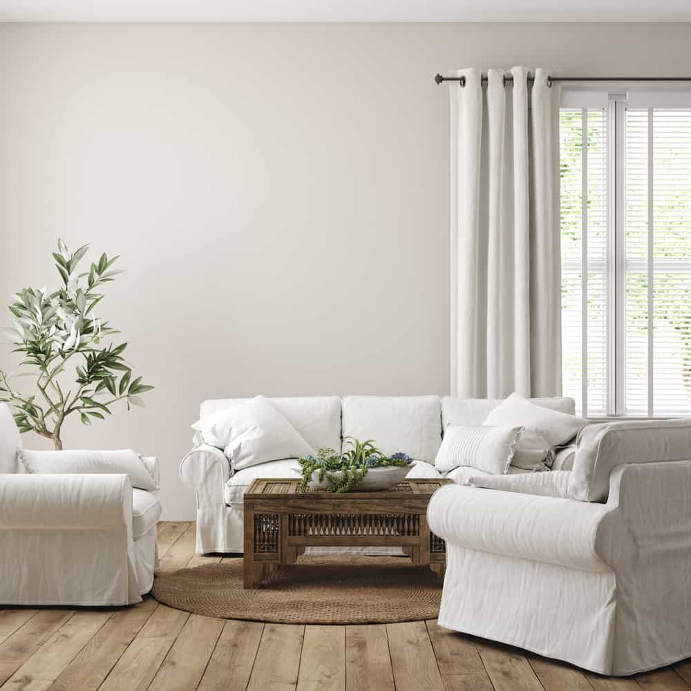 simple neutral color living room white sofa wood coffee table hardwood floors