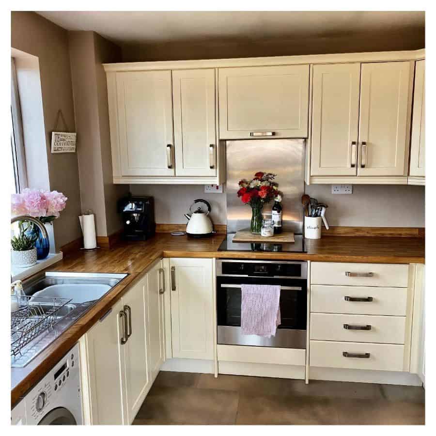 white cabinet kitchen wood countertop