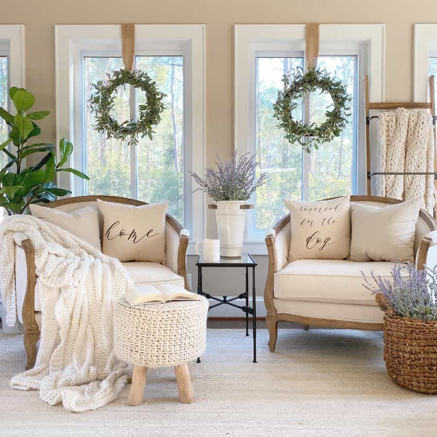 cozy farmhouse living room white lounge chairs hanging wreaths