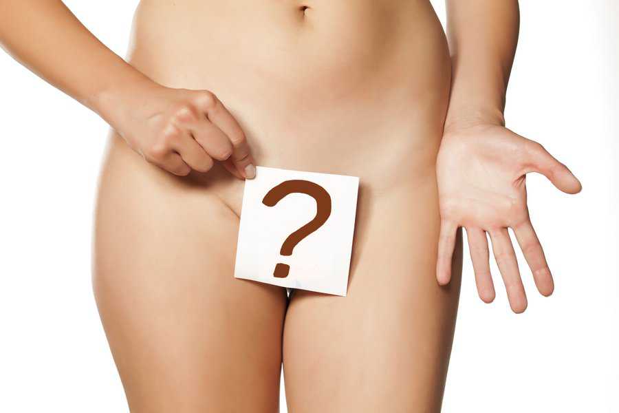 Woman,Holding,A,Question,Mark,Drawn,In,Front,Of,Her