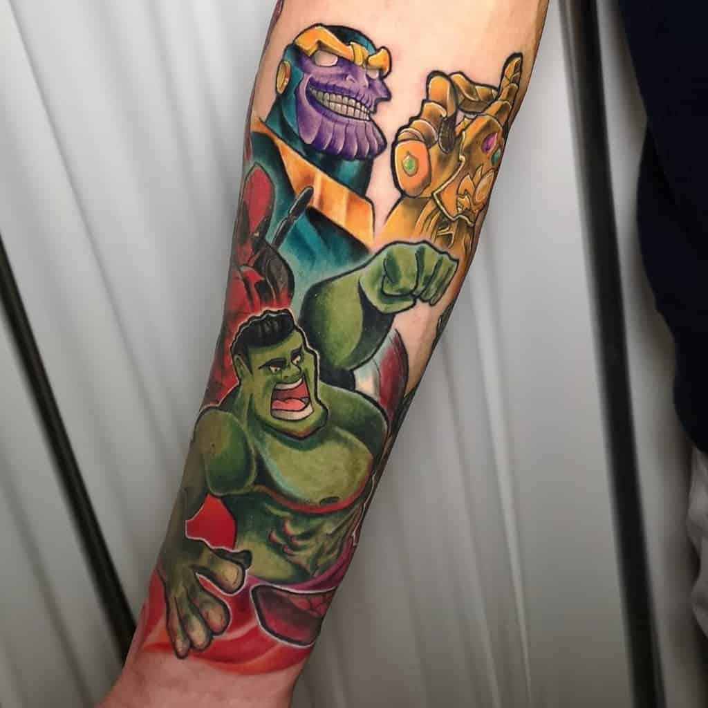 A bold Marvel tattoo featuring Thanos, the Infinity Gauntlet, and the Hulk in dynamic colors and comic-style shading