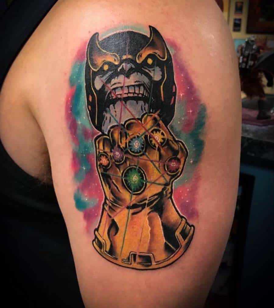 Bold Thanos tattoo with a menacing grin, showcasing the Infinity Gauntlet with all six stones in a vibrant comic-style design