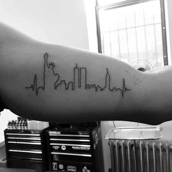 Tattoo of NYC skyline with heartbeat line on a bicep