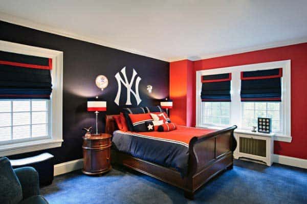 New York Yankees-themed bedroom with blue carpet, red and navy decor, and team logo.