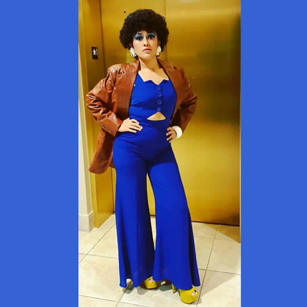 blue over all with brown leather jacket 