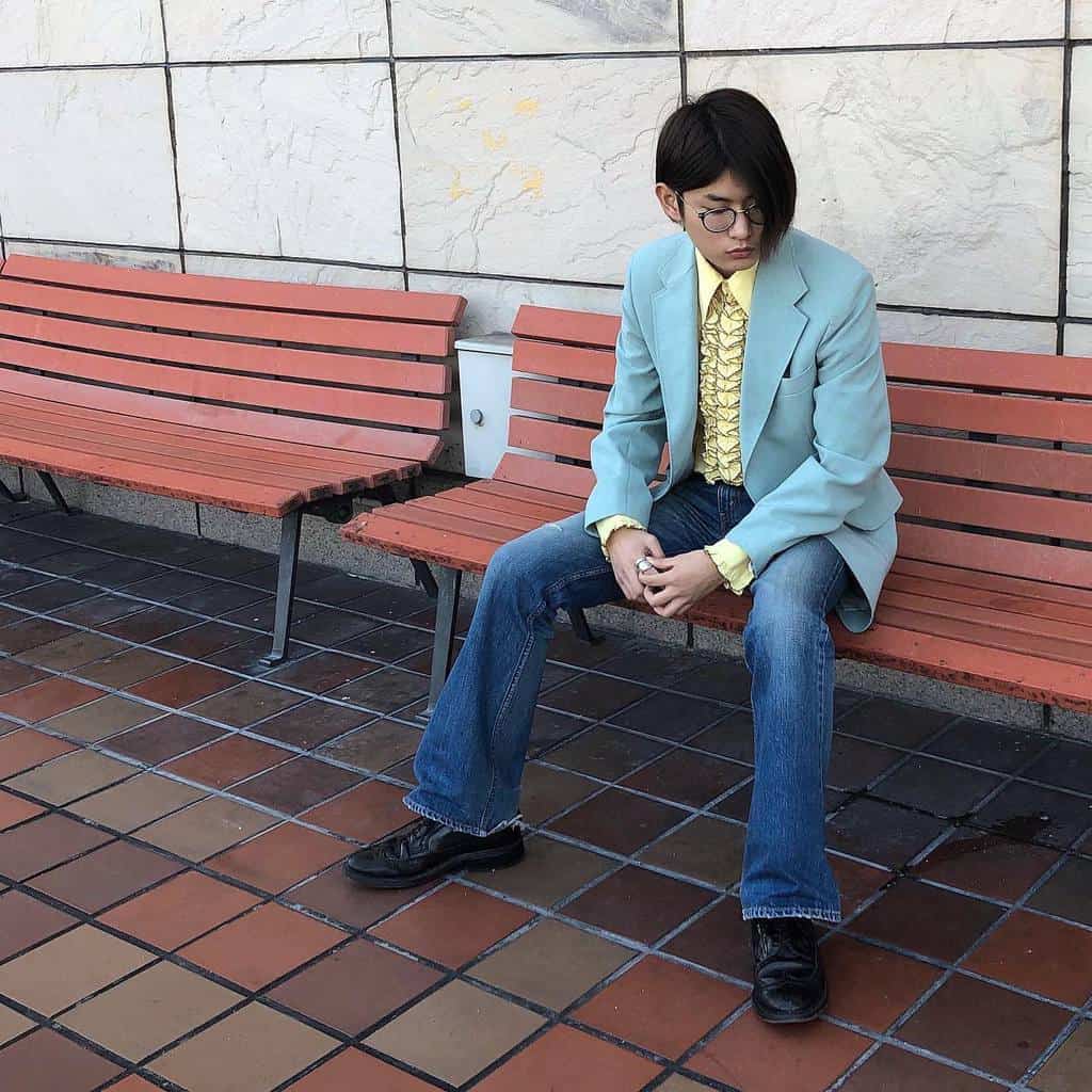 light blue coat under the yellow polo and denim jeans 