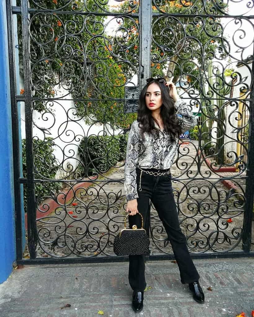 black printed long sleeve with cool belt on black pants