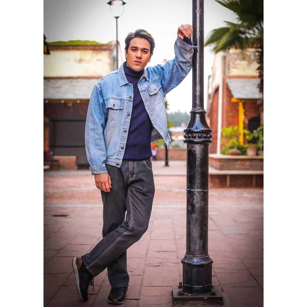 cool denim jacket and pants under blue shirt 