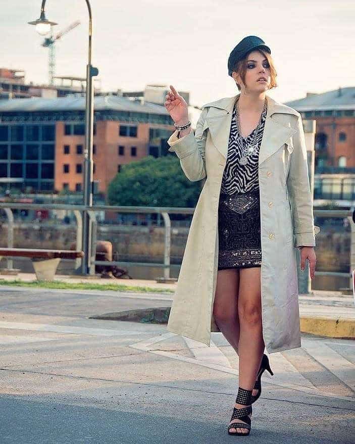 long gray coat under zebra top and skirt with cool hats