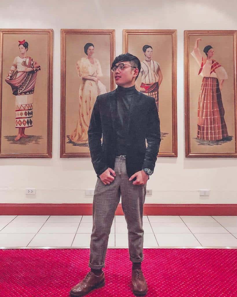 turtle neck with black coatb and checkered pants cool eyeglass