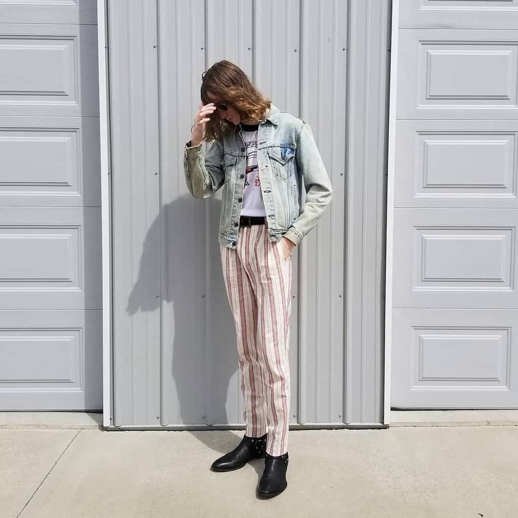 denim jacket with stripe pants and leather boots