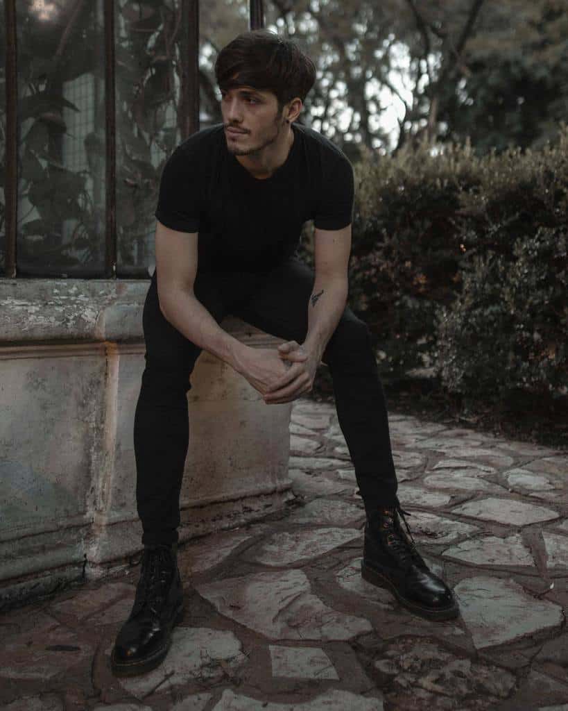 cool black shirt and pants with black leather boots