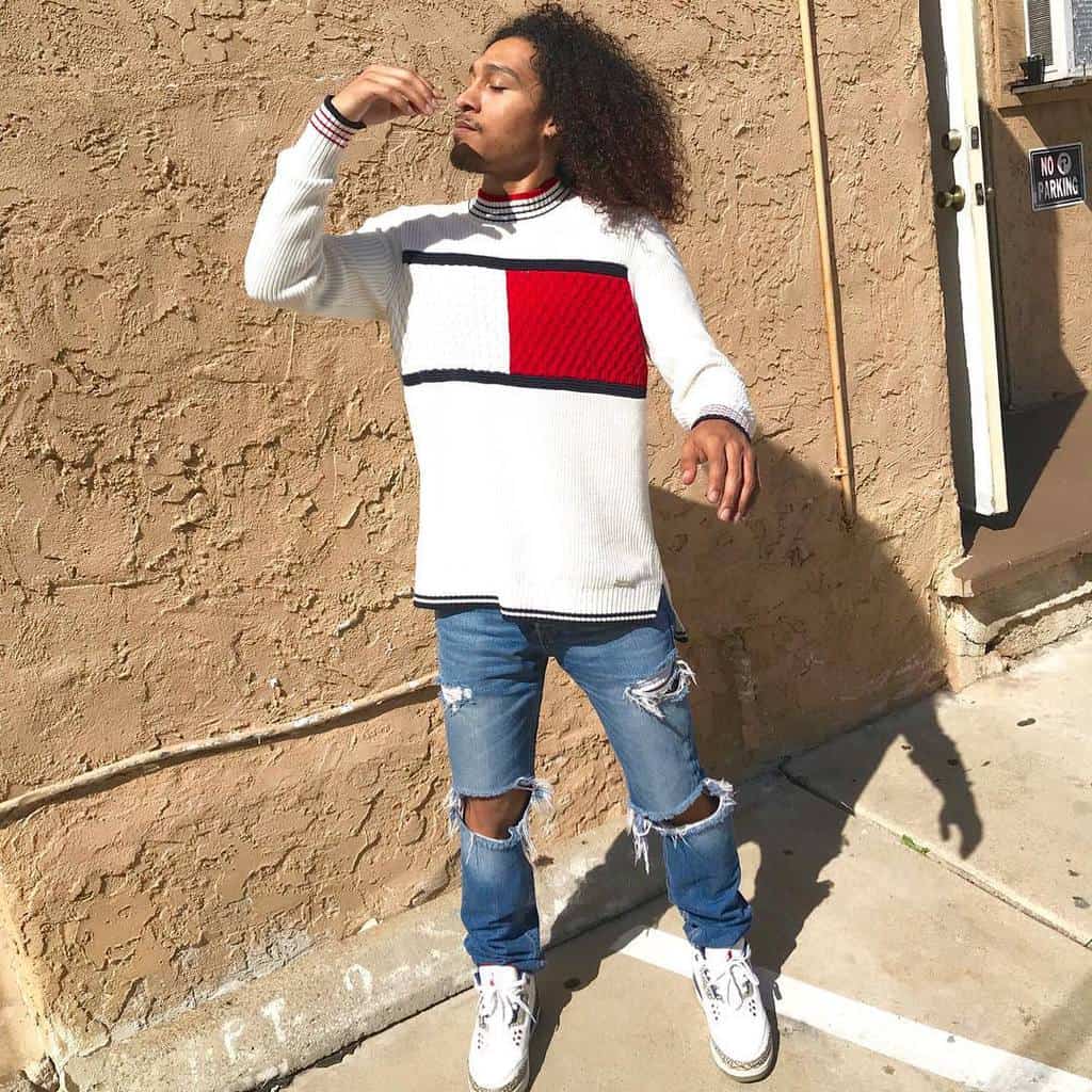 cool jacket with denim ripped jeans