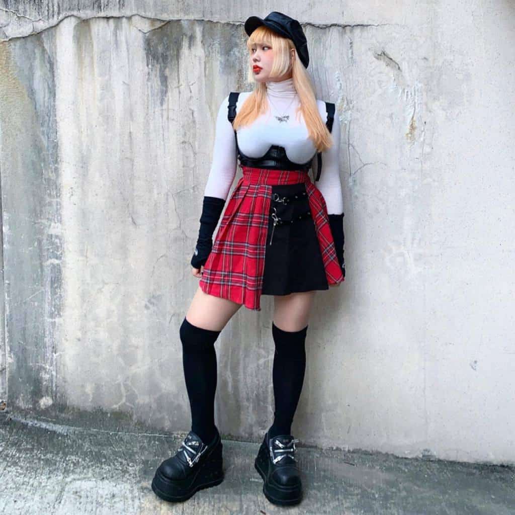 cool white long sleeve with black overall and red checkered around waist