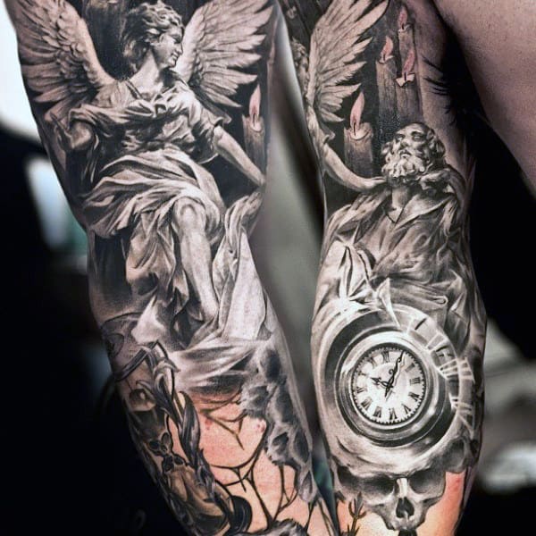 Detailed black and gray tattoos on arms depicting an angel, a bearded man, and a clock