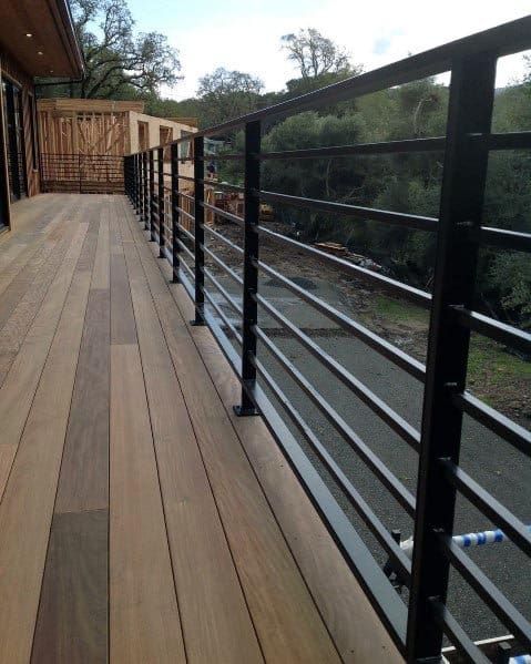 wood deck with black metal railing