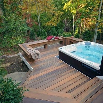 wood deck and bench seat hot tub nature view