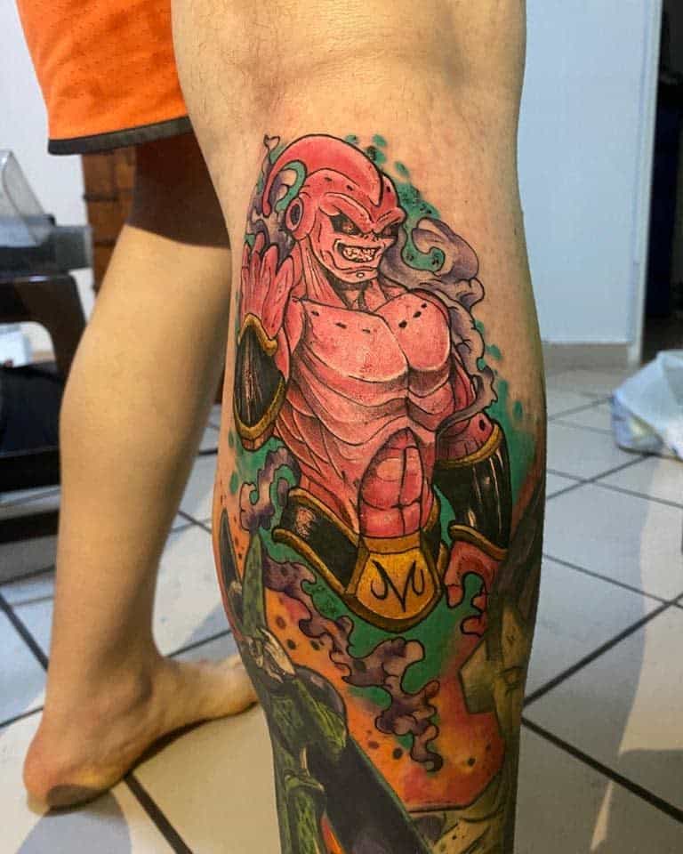 A vibrant tattoo of Majin Buu from Dragon Ball, with colorful energy surrounding him, showcasing his muscular form and iconic design.