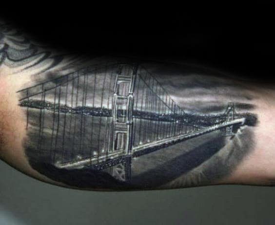 Night Sky With Lit Bridge Mens Inner Arm Tattoos