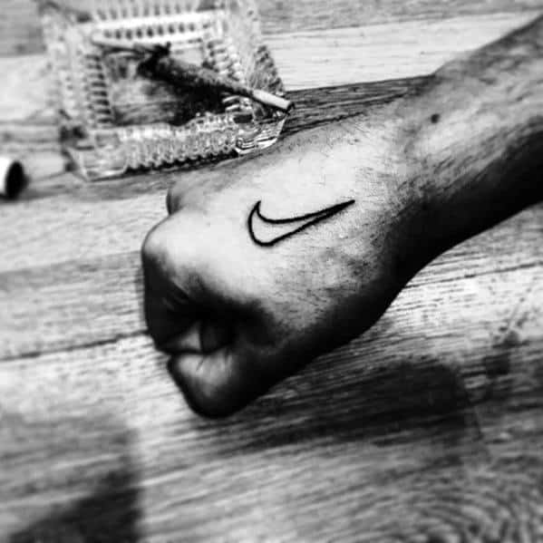 Nike Logo Guys Side Of Hand Tattoo Design
