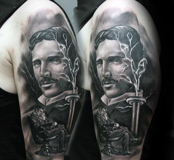 Black and grey tattoo of Nikola Tesla with lightning bolts, a Tesla coil, and a scene of him seated in his lab beneath the portrait.