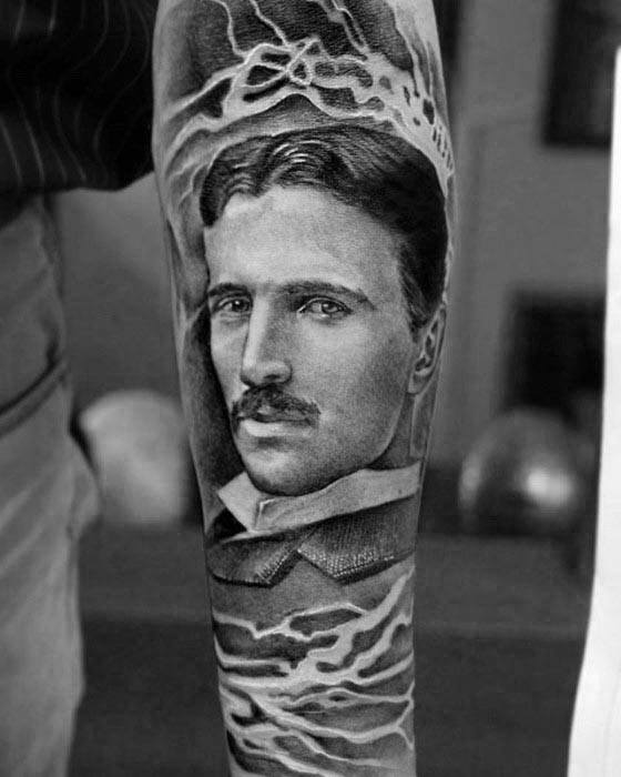 Realistic black and grey portrait tattoo of Nikola Tesla with lightning bolts flowing above and below, creating a powerful energy effect.