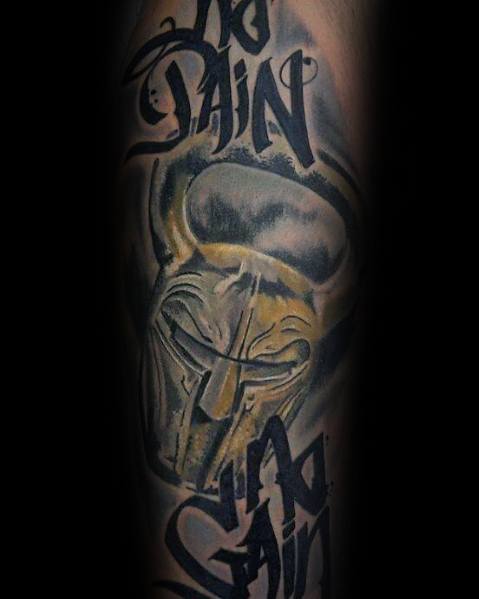 Bold tattoo featuring a kettlebell with a Spartan helmet design and "No Pain No Gain" text, symbolizing strength, resilience, and warrior mentality.