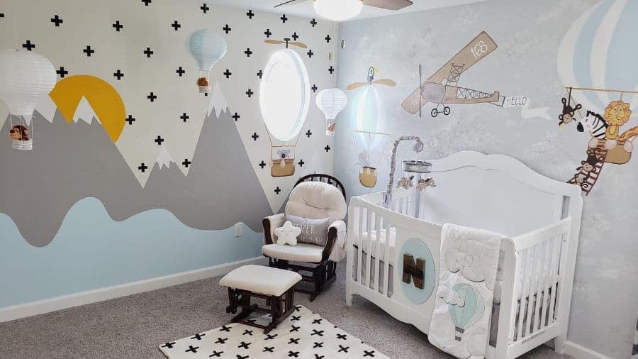 baby nursery mountain and plane wall murals white crib wood chair and footrest